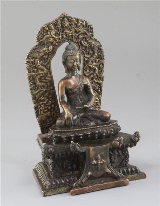 A Himalayan bronze seated figure of Buddha Shakyamuni, Qing dynasty, total height 18.5cm